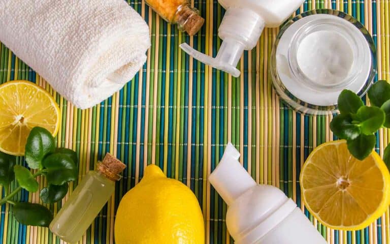 Eco friendly and natural cleaning supplies are pictured on a vibrant backdrop | Household Staffing