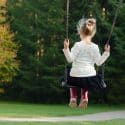 Young girl on a swing