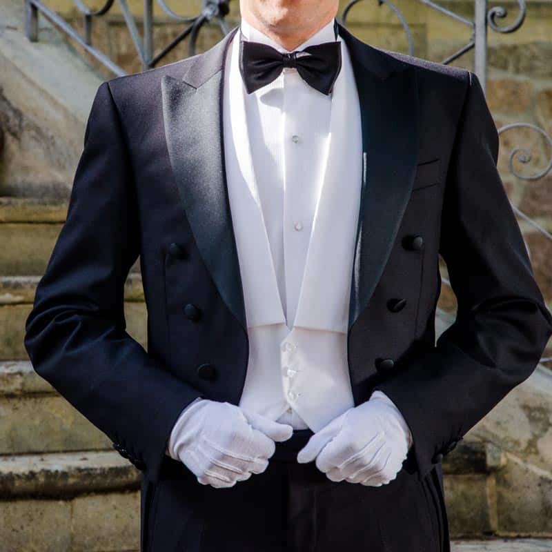 Image of a butler posing in full dress. | Household Staffing