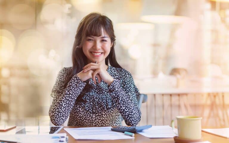 Personal assistant at desk smiling