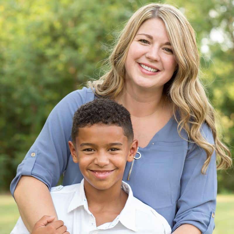 Nanny poses with young boy