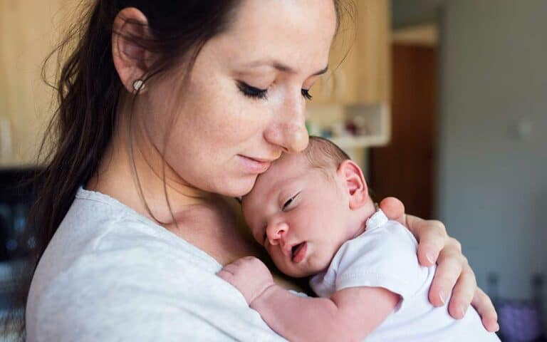 A mother bonding with newborn | Household Staffing