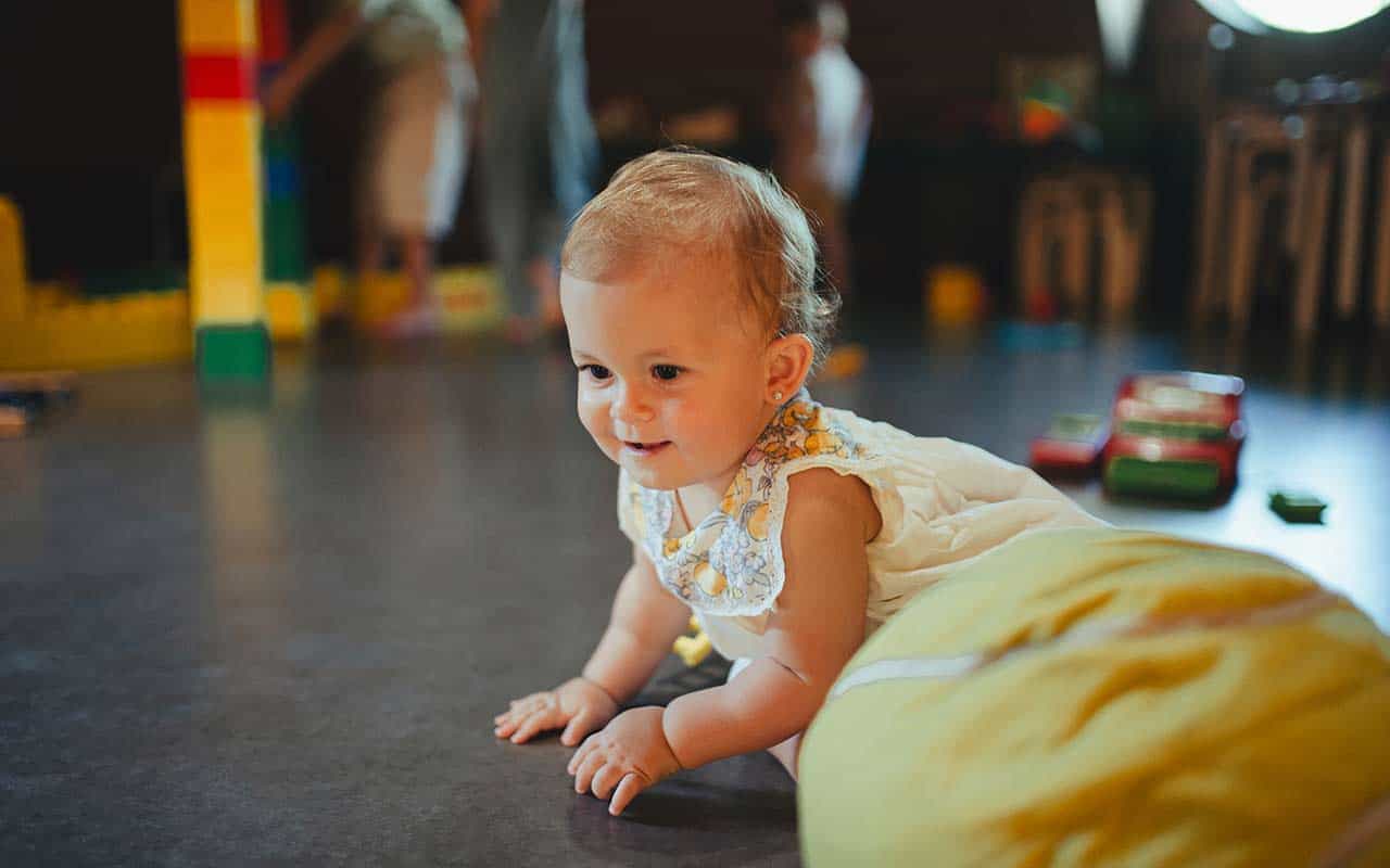 Infant freely exploring a safe, RIE inspired play area | Household Staffing 